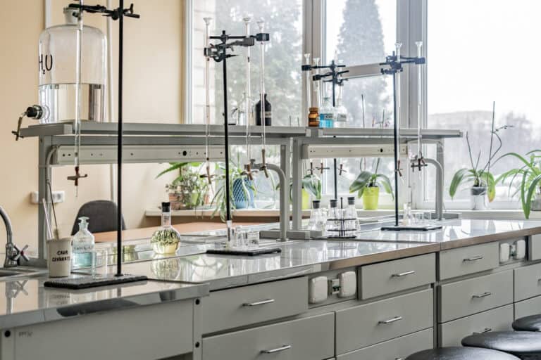 chemical laboratory with science equipment on shelves